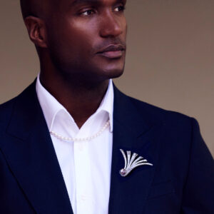 Model wearingg Fanfare Tahitian Brooch by Assael