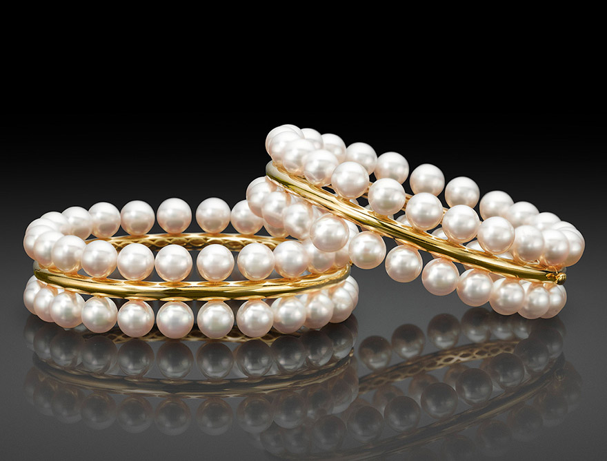The Forever Bangle Two rows of Akoya Cultured Pearls are seamlessly set side-by-side on a band of 18K yellow gold. Available with or without pavé diamonds. 