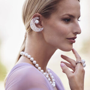 Model wearing White Crescent Moon Earrings