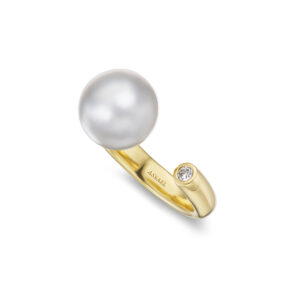11.0mm South Sea Cultured Pearl and a half-carat Diamond set on an angle across an open band of 18K Yellow Gold